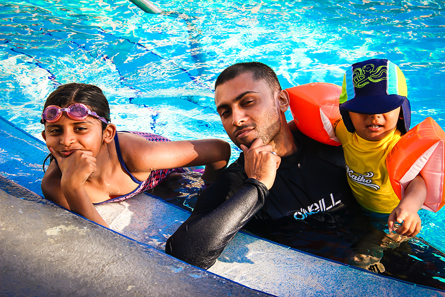 Florida Road Trip adventure - Sukh, Shalini and Shivam in the pool in Florida