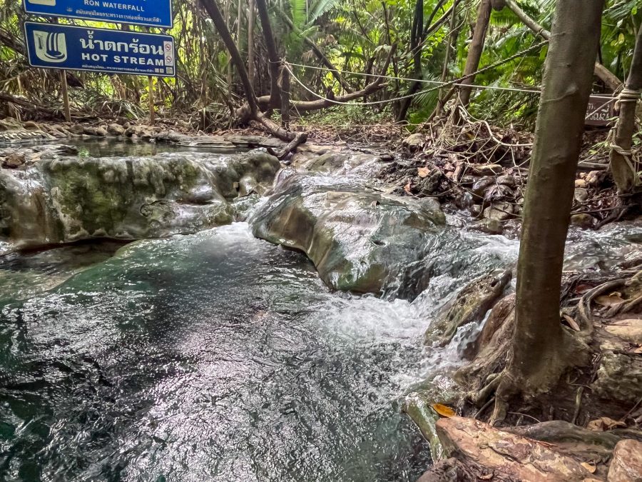 Relaxing in the soothing waters of Krabi's natural hot springs, surrounded by lush greenery