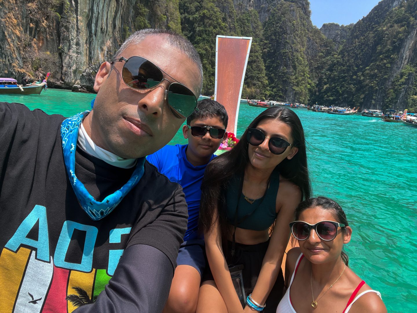 Sukh, the kids and I on a longtail boat -Family Friendly Places In Thailand - Hong Island
