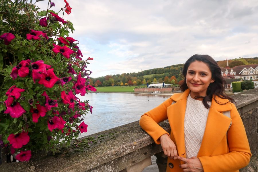 Person standing on a bridge over the River Thames in Henley-on-Thames.