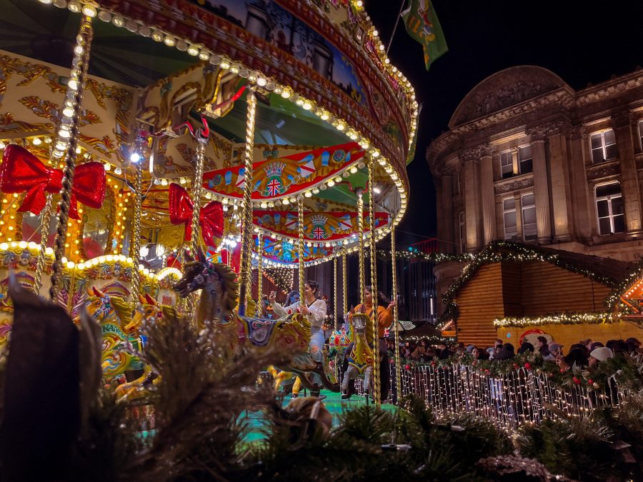 Birmingham with wooden stalls, mulled wine, carousel and festive lights.