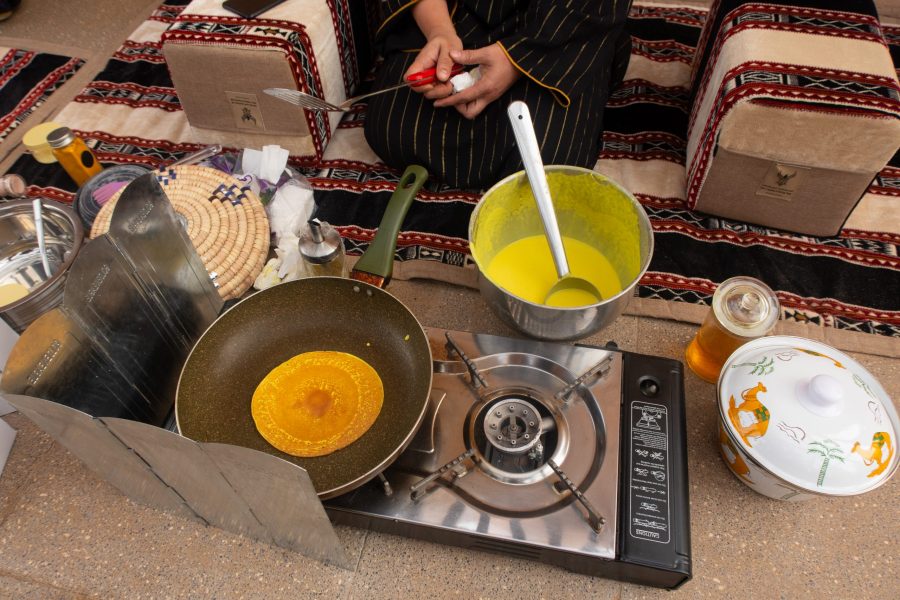 Making pancakes with Jareb who lead women-only travel