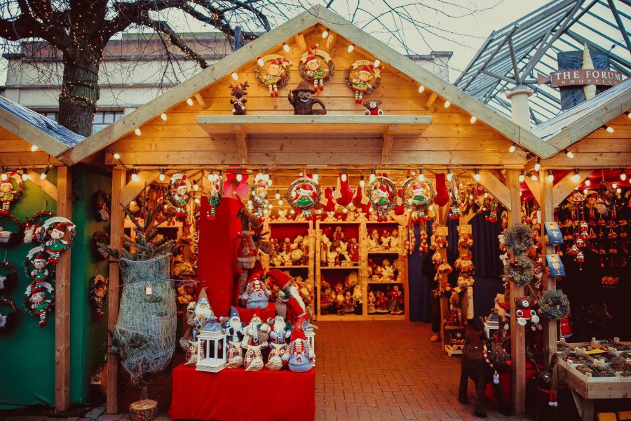 Wooden chalet with toys at a christmas market for festive family adventures