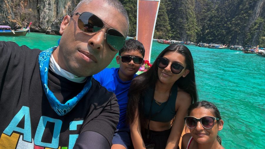Rosie and her family on a longtail boat