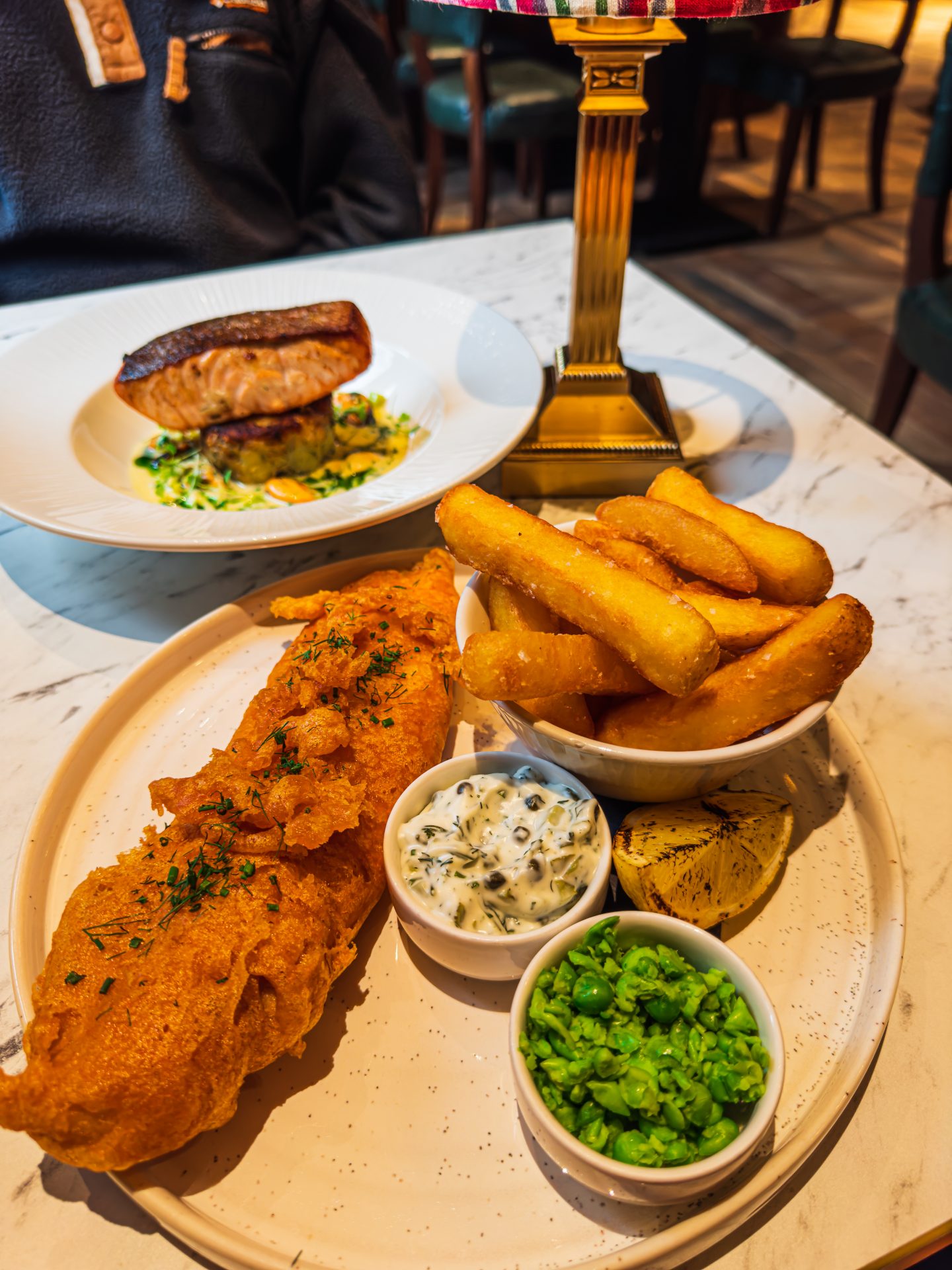 Fish and chips on a plate at The Maynard Inn during a Peak District walking and wellness break.