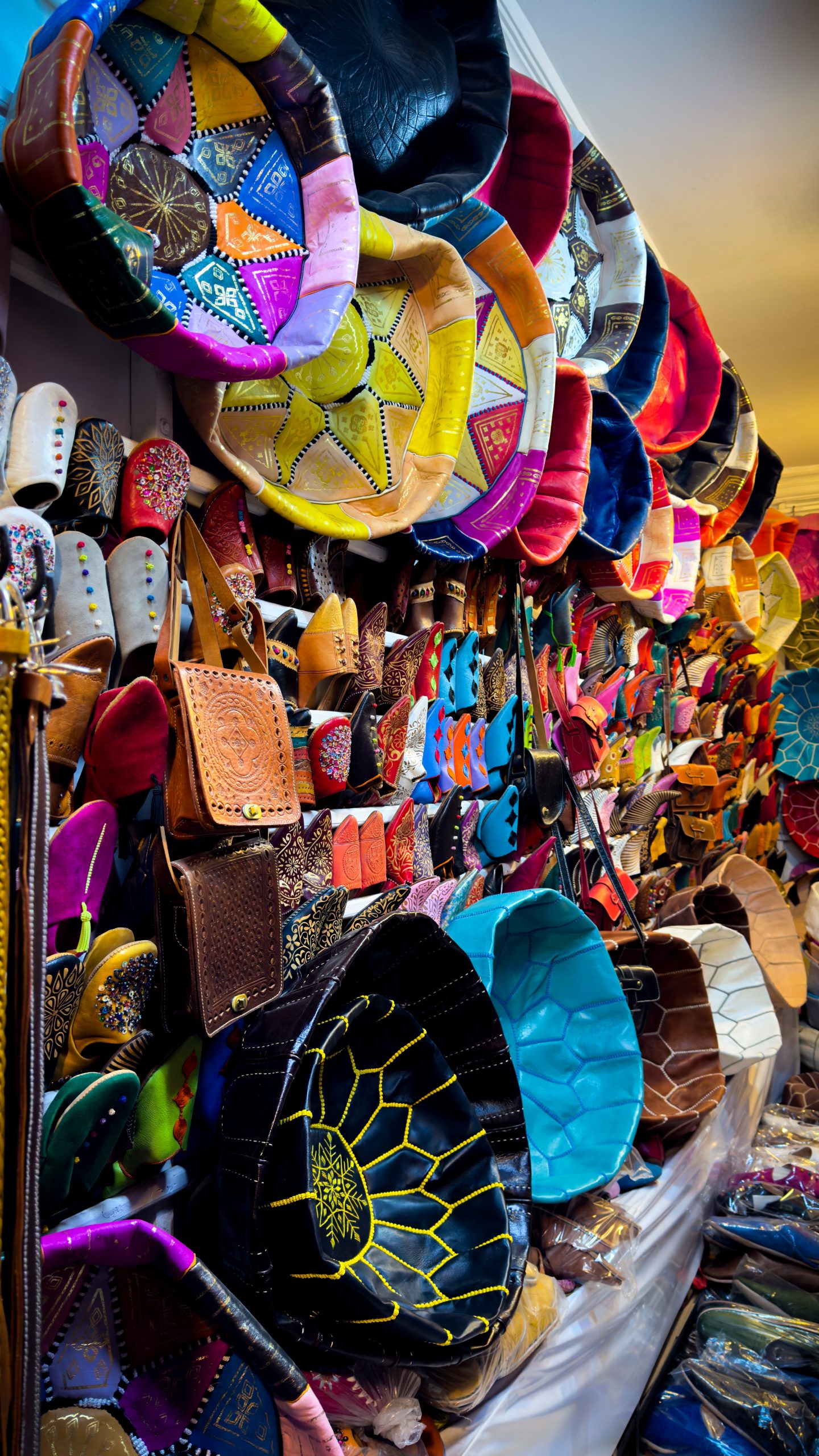 Various bags, shoes and cushions in a souk