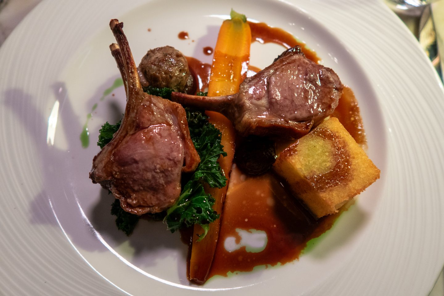 Lamb on a plate with potatoes and vegetables