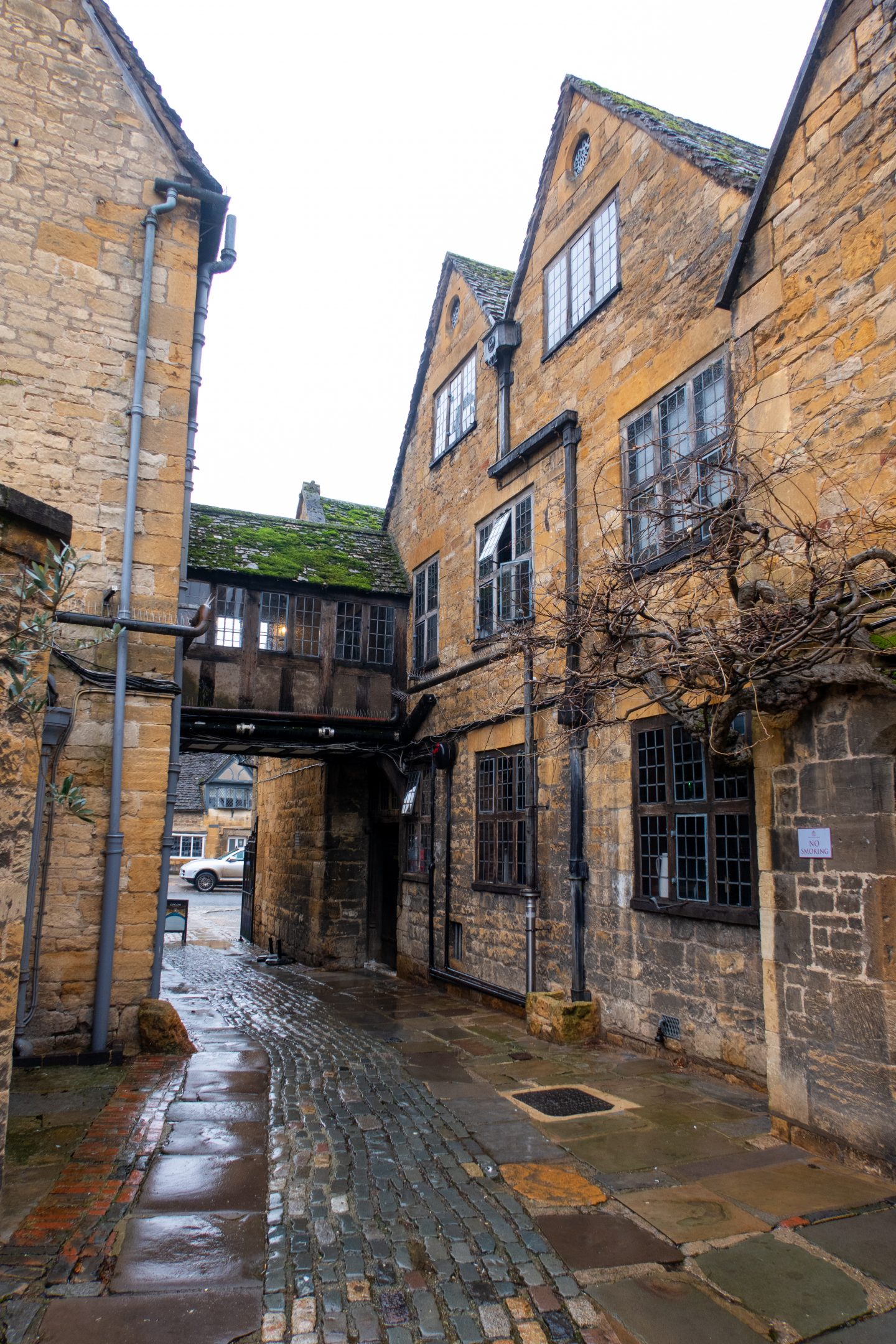 Exterior view from the back of The Lygon Arms in the rain