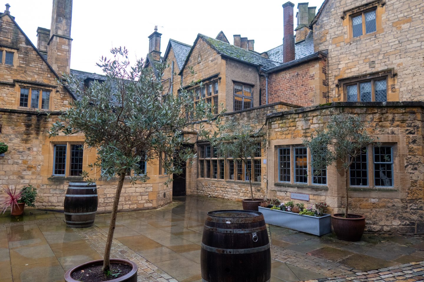 The Lygon Arms hotel building in the rain