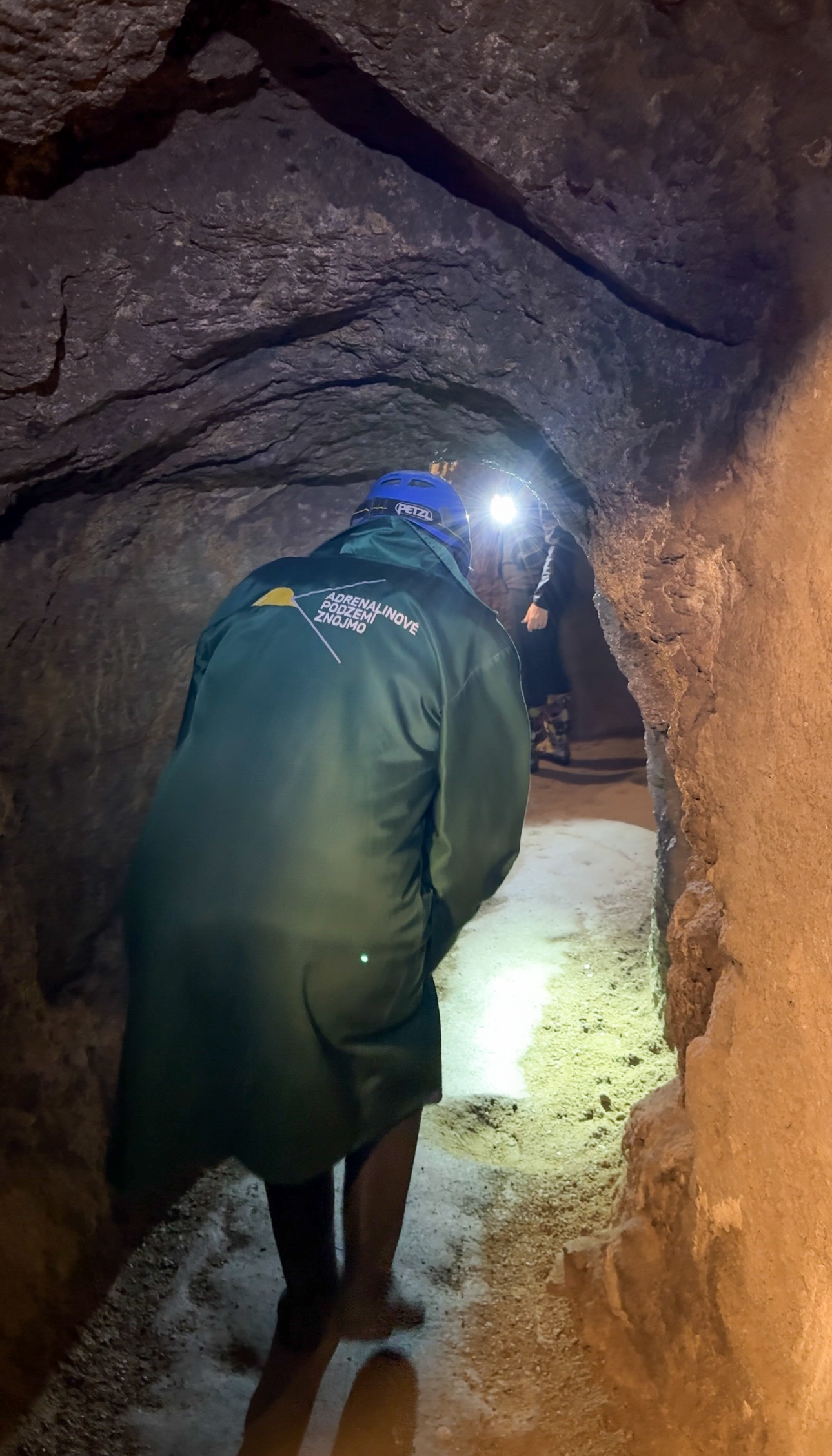 A woman bending over to navigate an underground tunnel on Znojmo