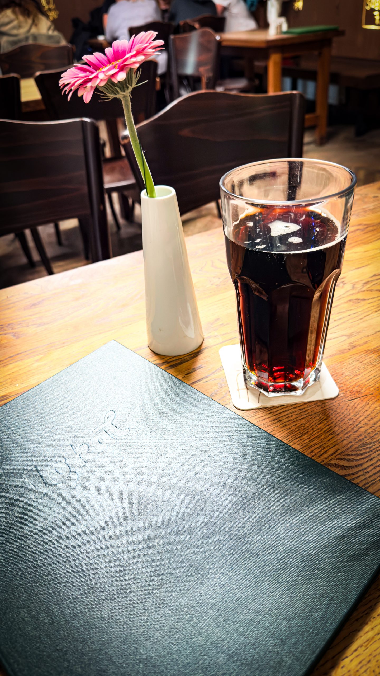 A menu and Kofala on a table