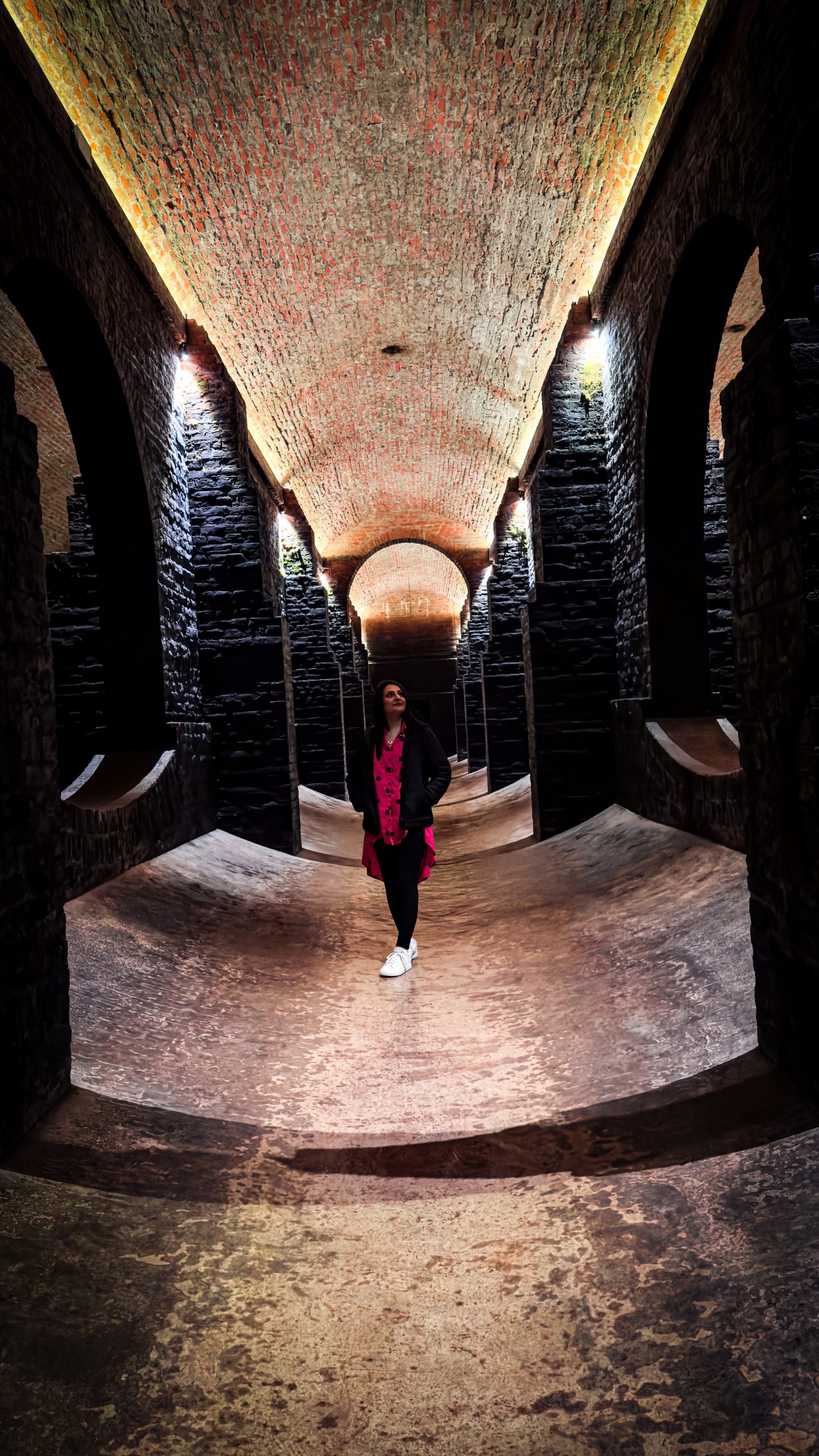 A woman standing in the Water Tanks, Brno, one of the top things to do in Brno