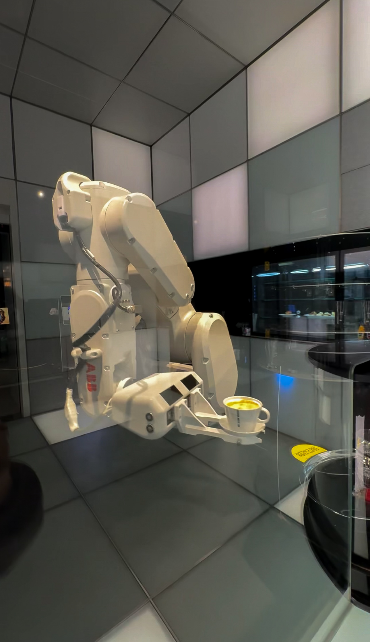 The robotic arm making coffee in robot cafe