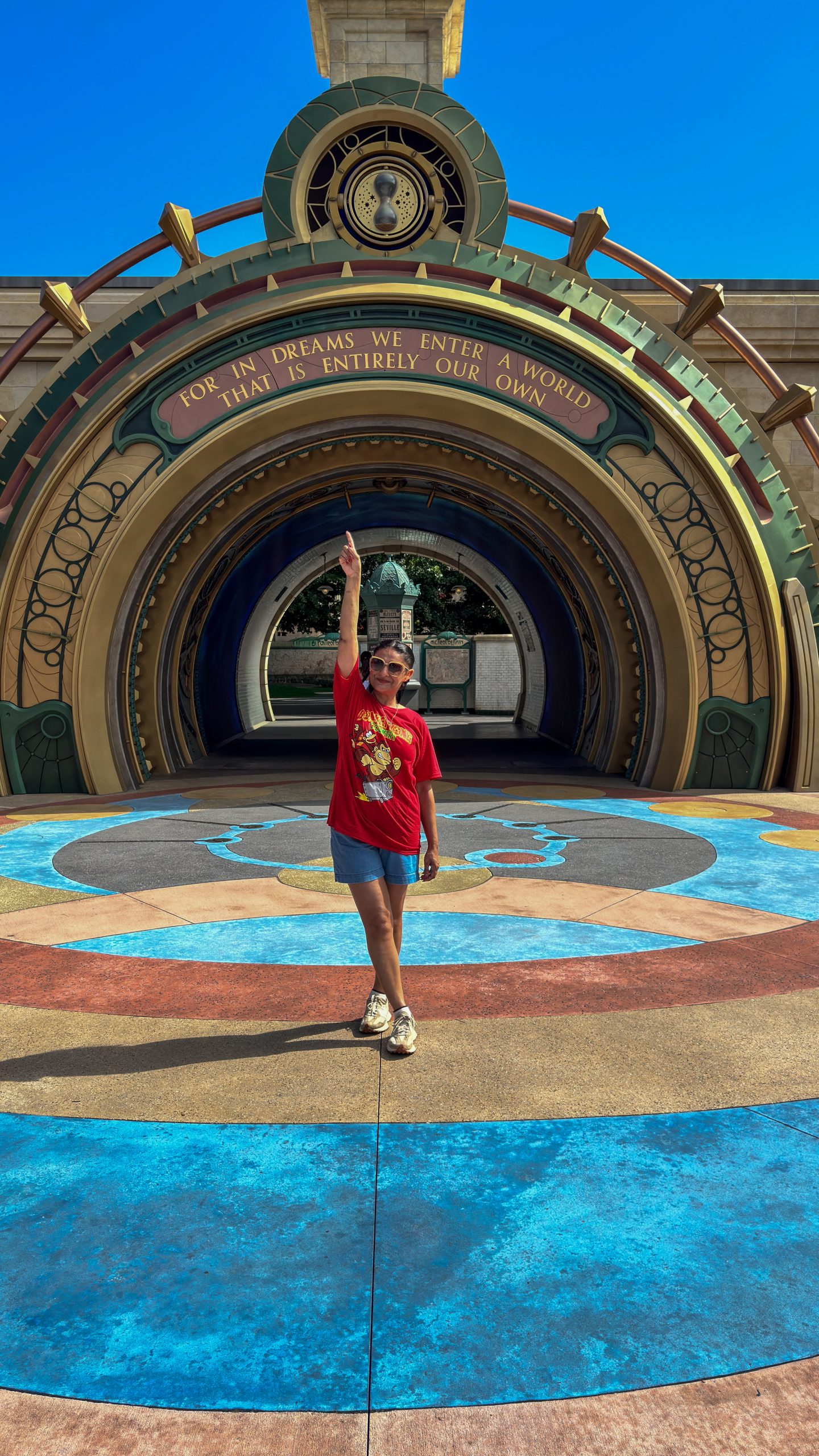 Woman standing outside Epic Universe portal