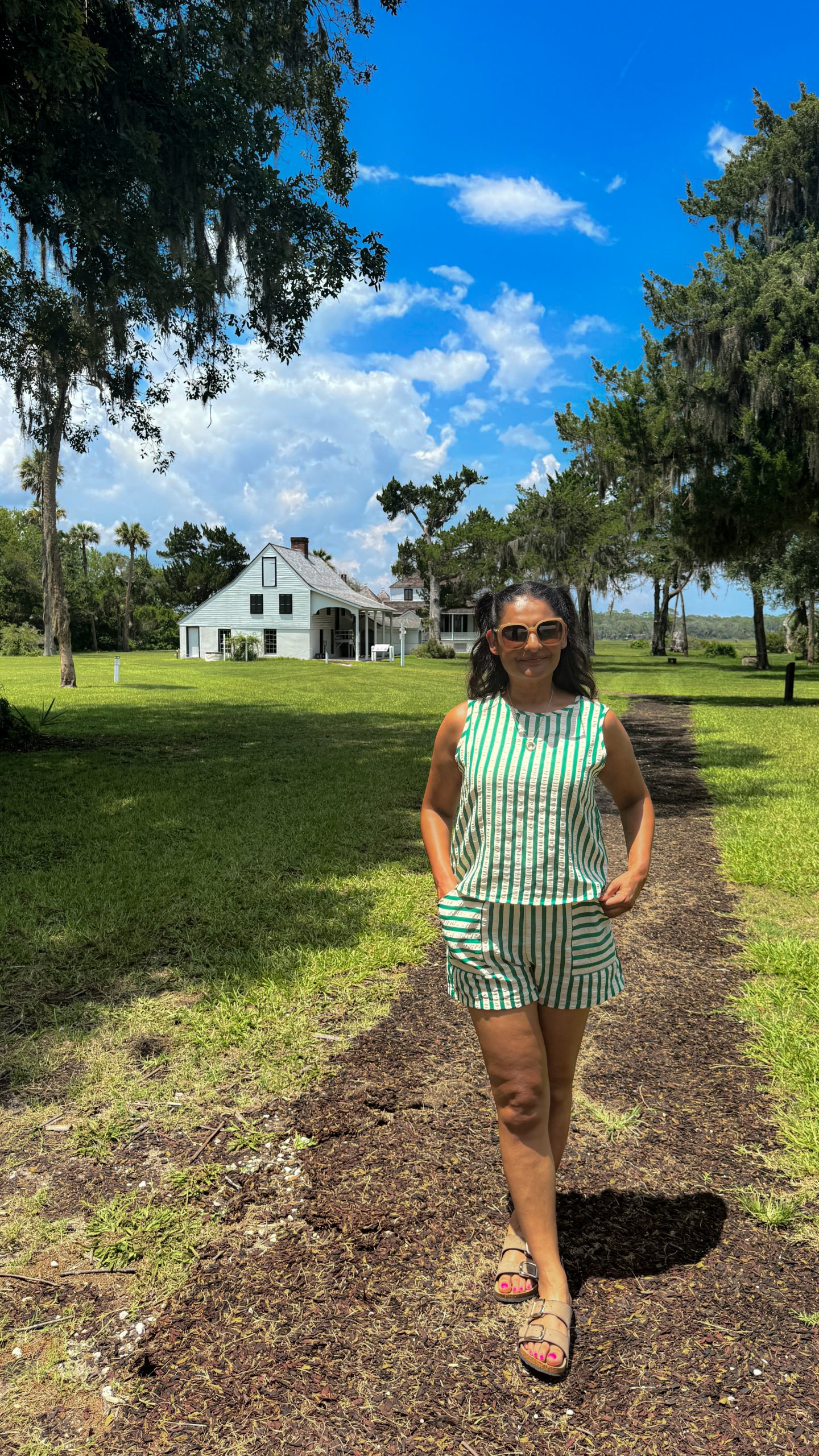 Woman standing in front of the Kingsley Plantation in Jacksonville