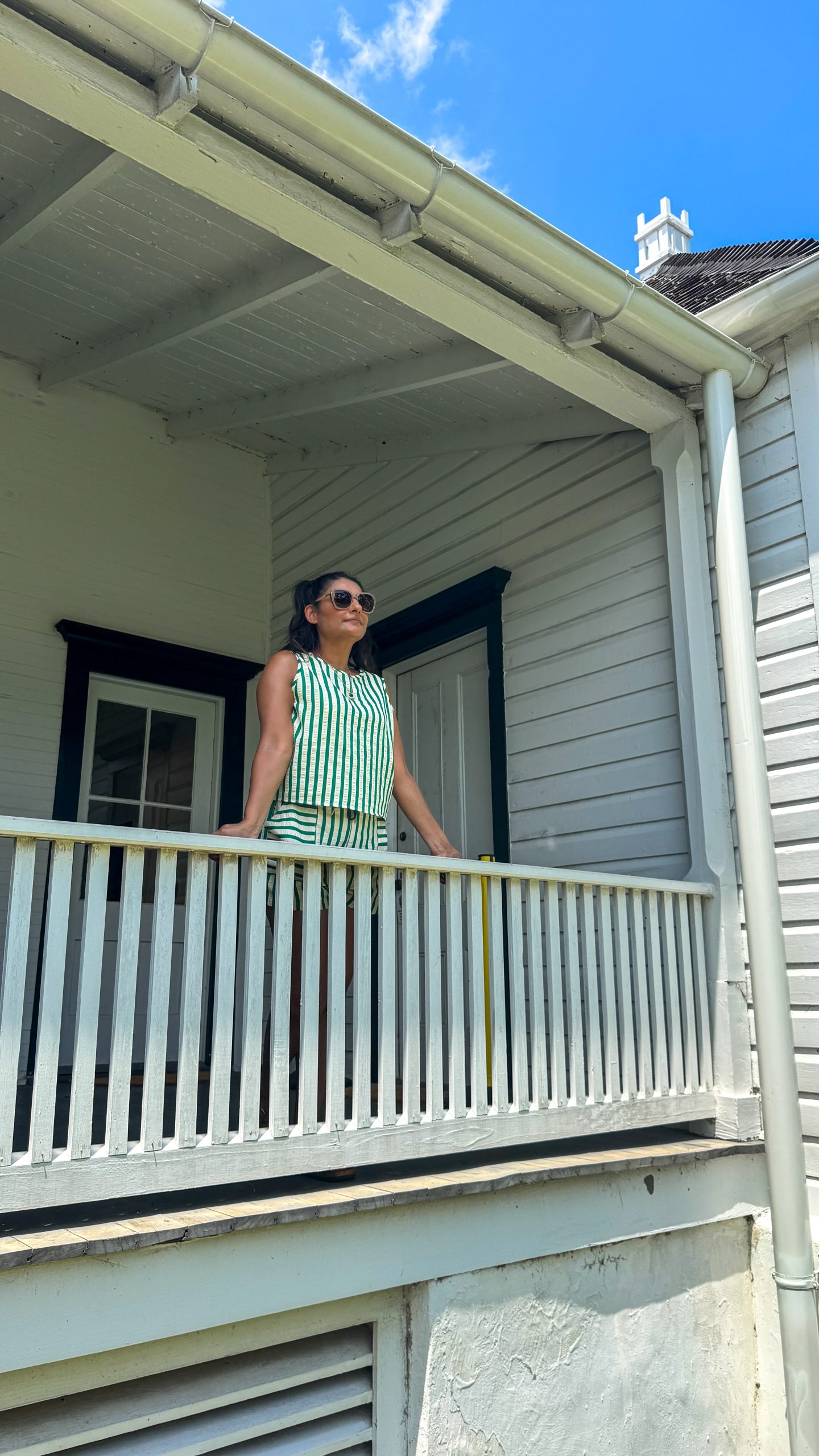 Woman standing on the porch at the Kingsley Plantation