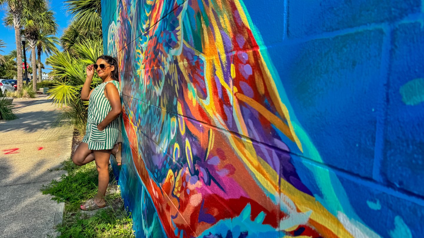 Woman standing in front of mural at Jax Beach