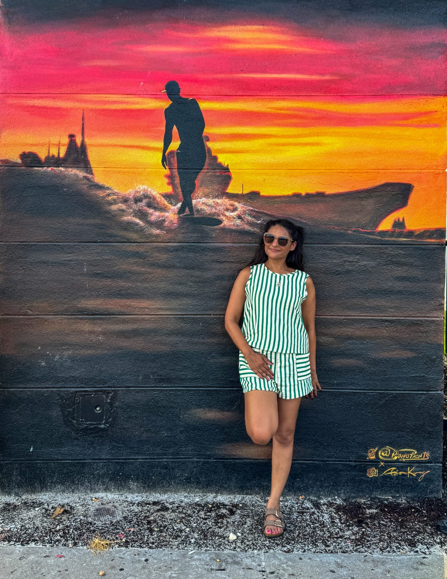Woman standing in front of a mural on Jax Beach