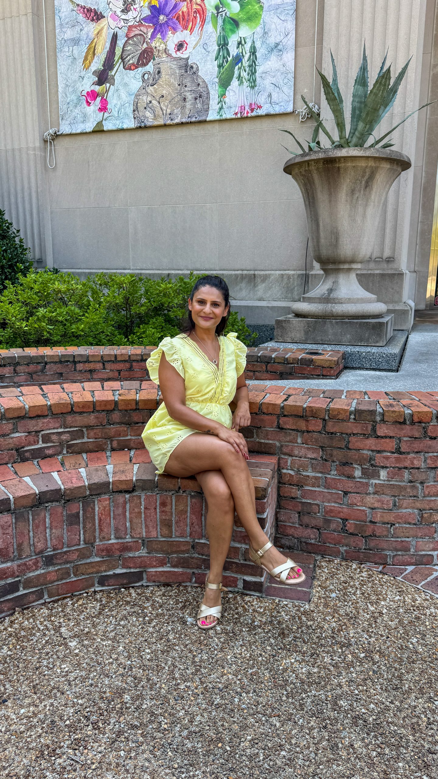 Woman sitting outside Cummer Museum of Art and Gardens