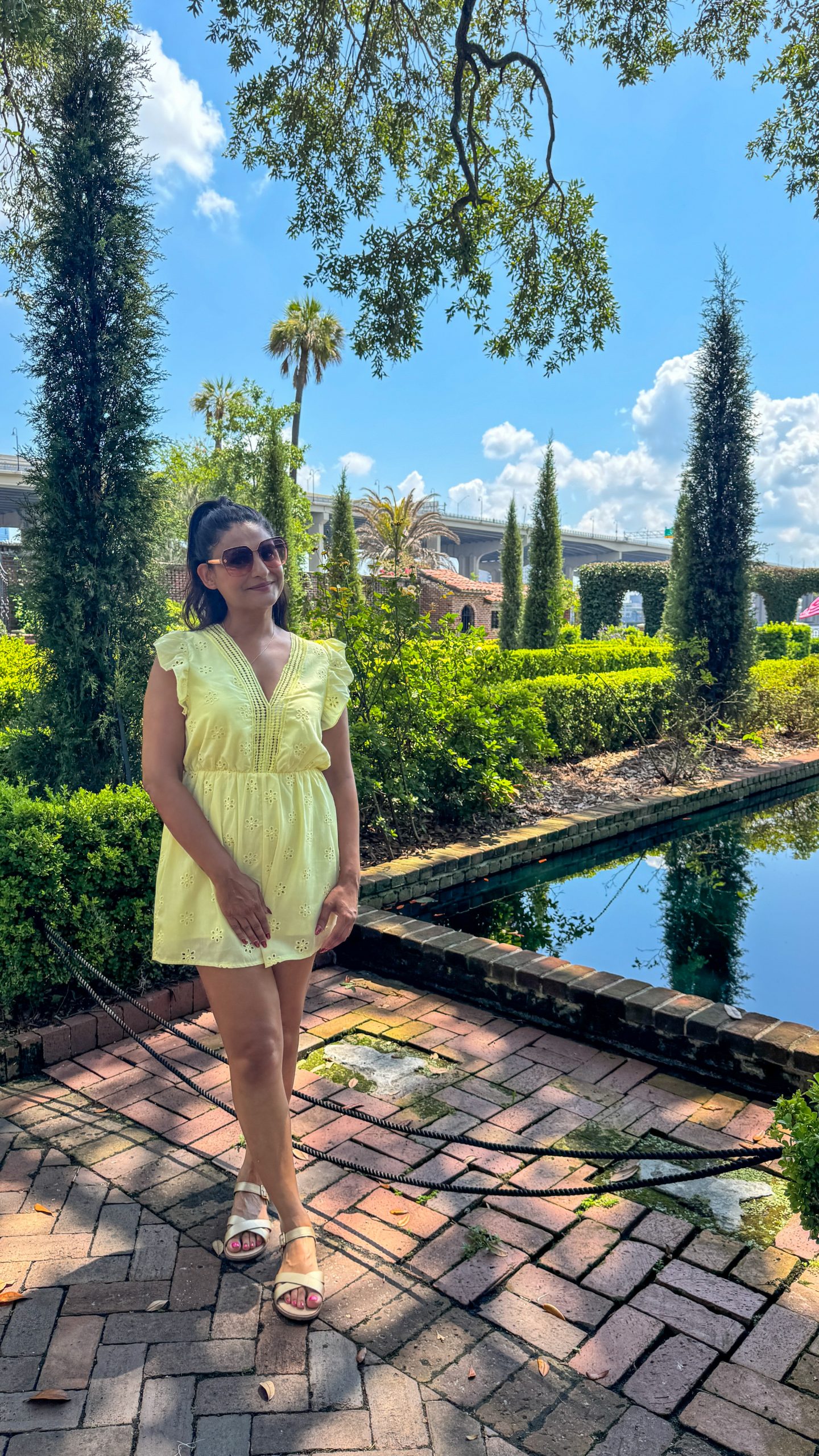 Woman standing in the gardens at Cummer Museum of Art and Gardens - Jacksonville after Orlando
