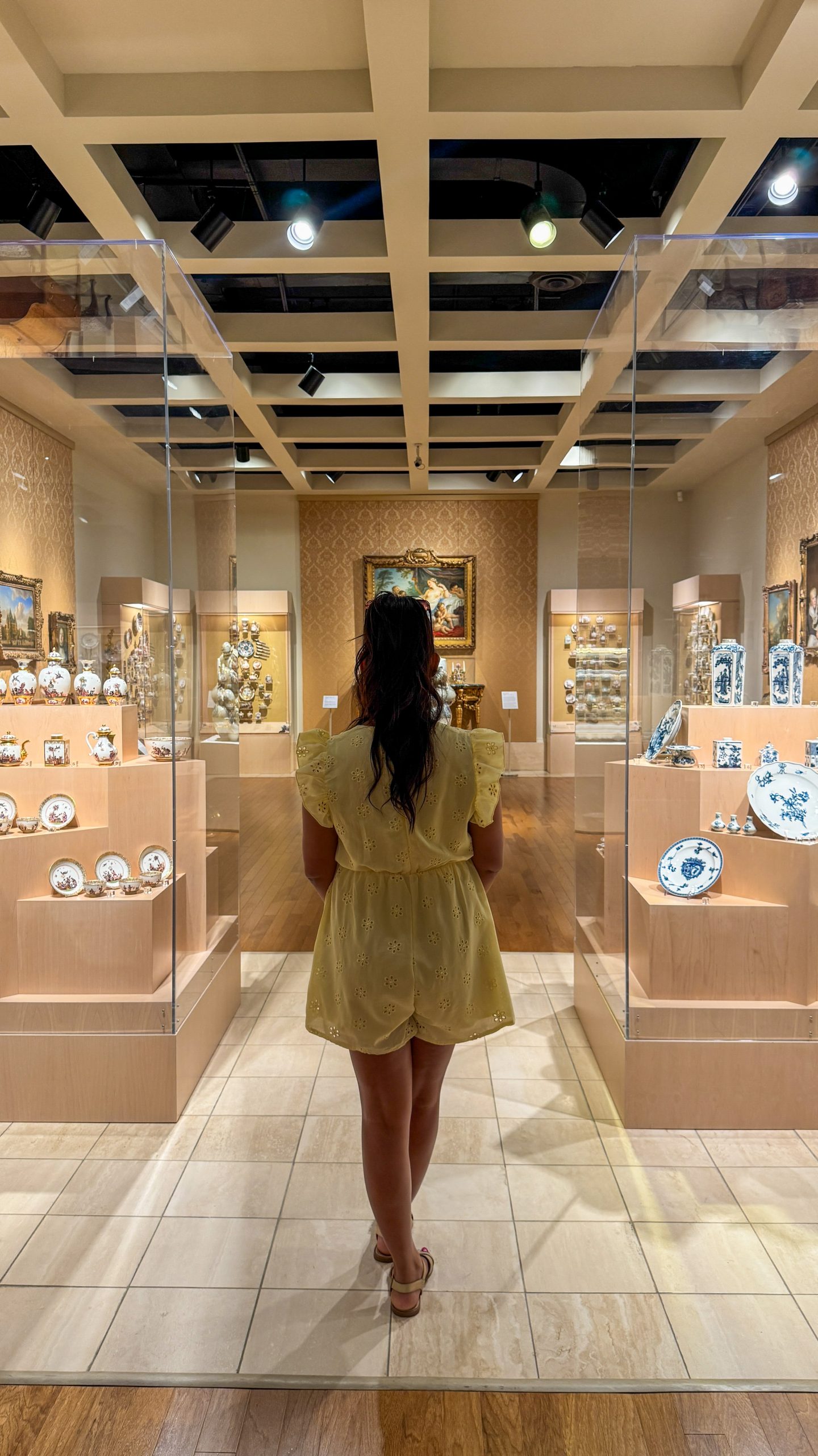 Woman standing inside the Cummer Museum of Art and Gardens in Jax