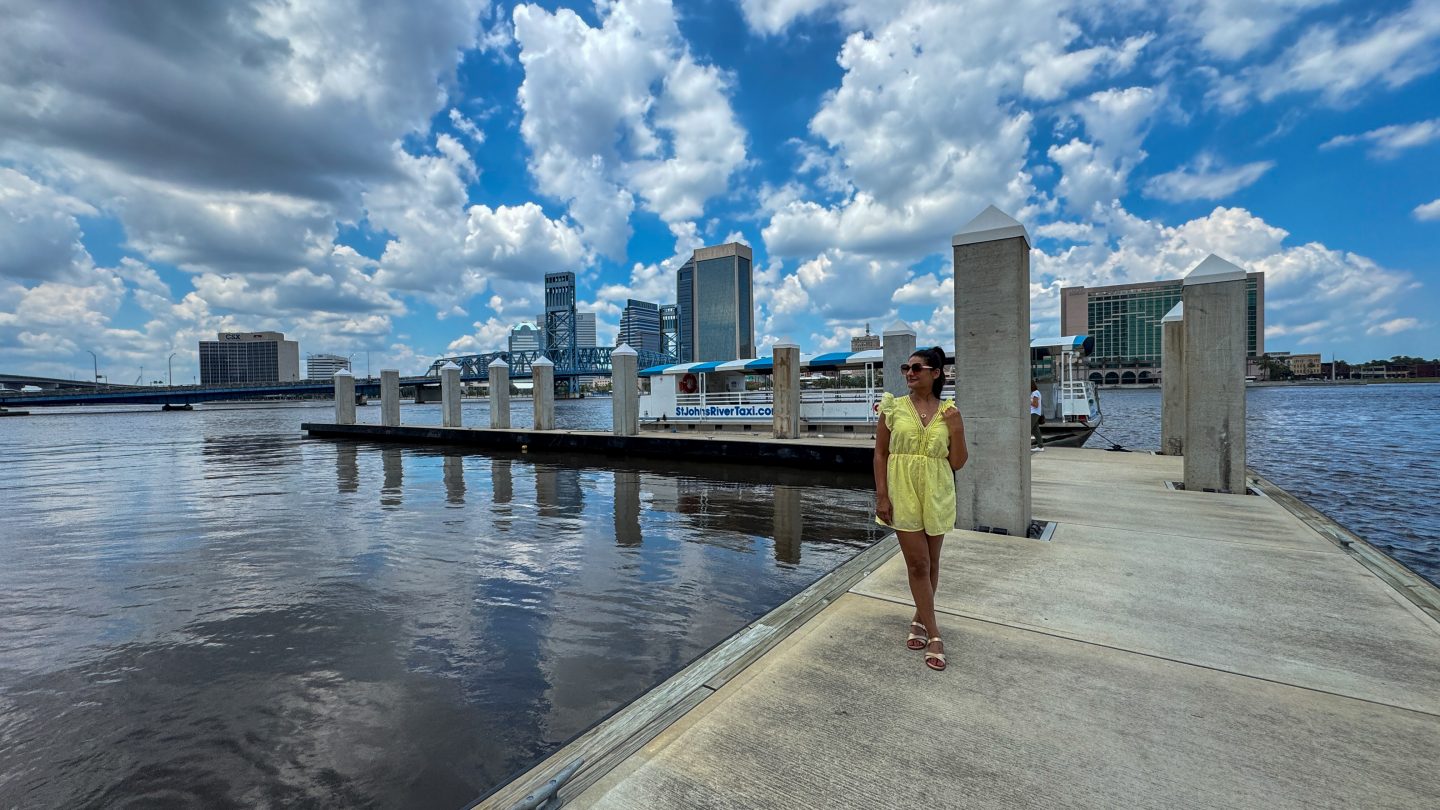 Woman standing on the dock waiting to board a water taxi on the St John's River in Jacksonville