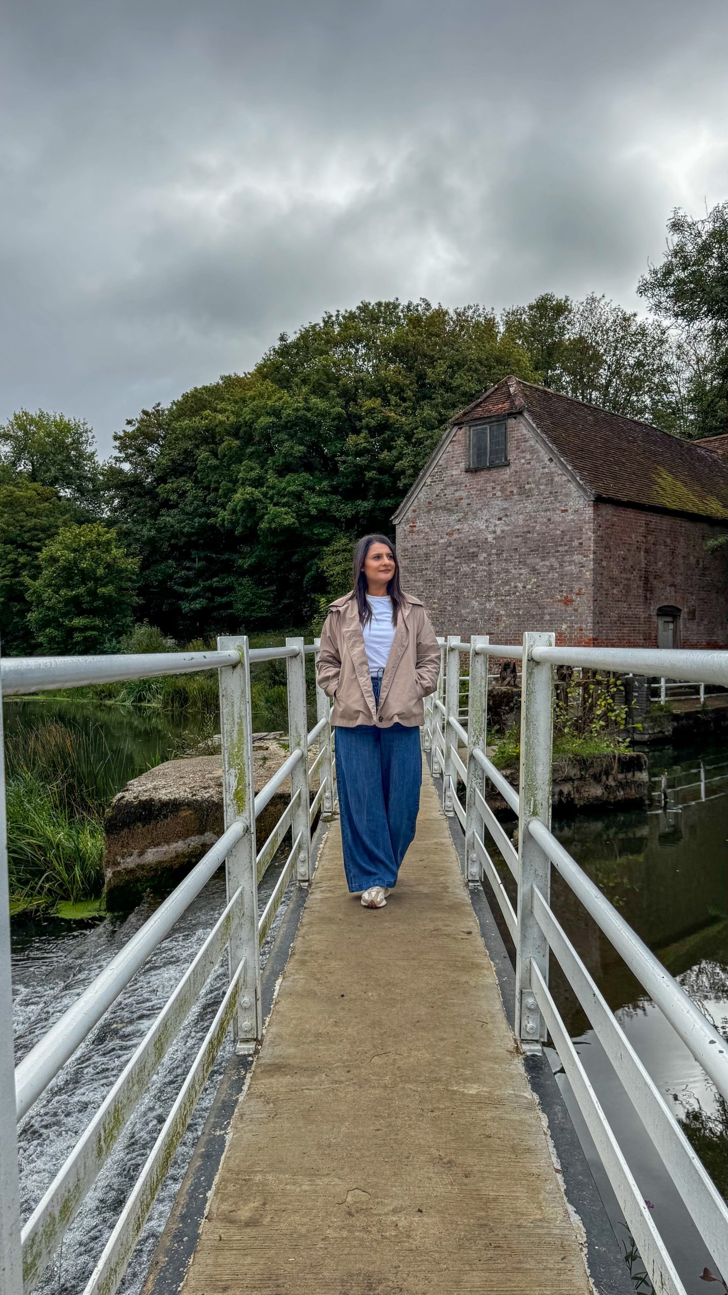 Woman standing at Sturminster Newton Mill in Dorset